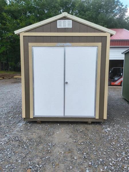 Garden shed with a 6' steel door
Siding color is brown
Trim color is almond
Roof color is almond