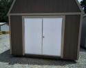 Lofted barn with a 6' steel door
Siding color is brown 
Trim color is tan
Roof color is tan